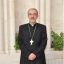 Irish parish priest delivers cheque to the Holy Land