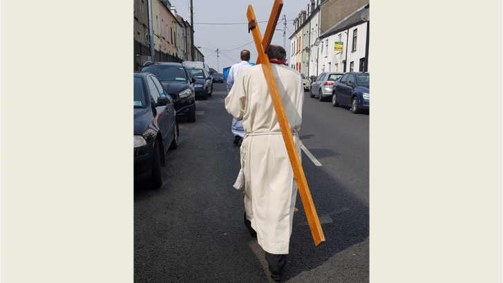 Bishop Phonsie carries cross around Waterford as sign of Good Friday hope