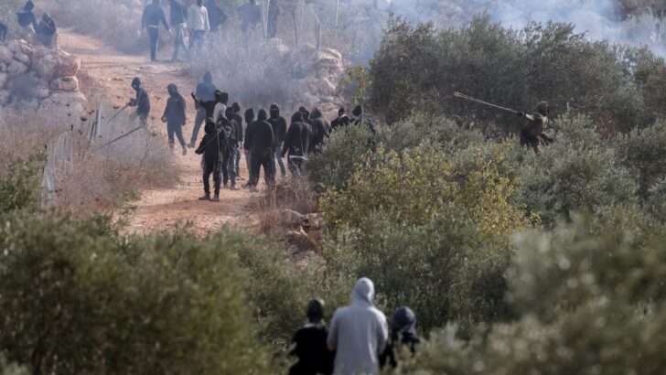 Israeli settlers attack olive harvest of Christian villagers in the West Bank